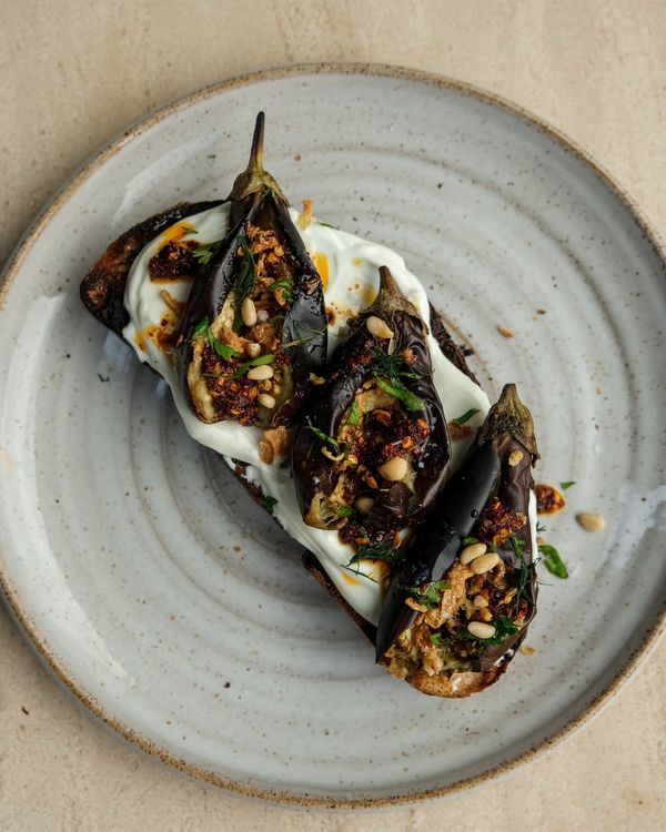 Baby aubergines on toast with Labneh and cumin chilli oil.