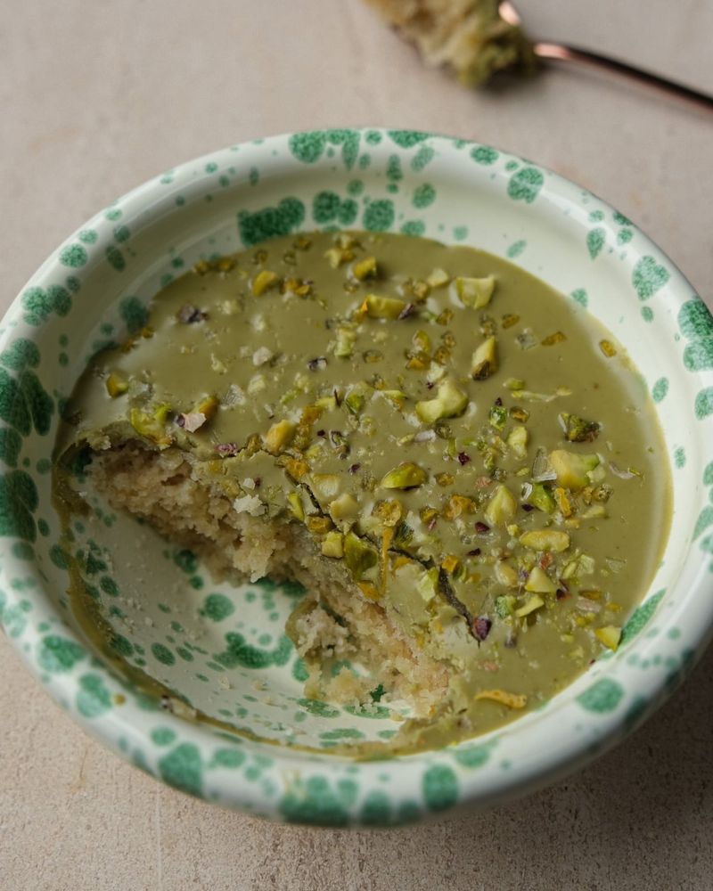 Lemon and pistachio friand in a mug