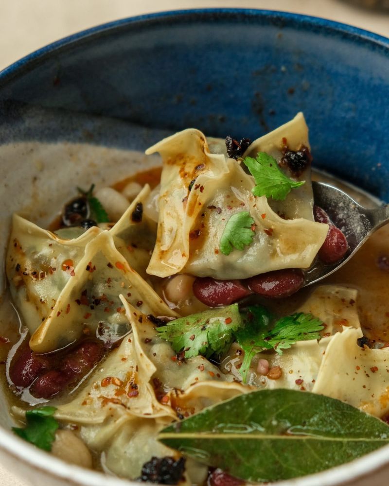Huitlacoche dumplings with bean stew