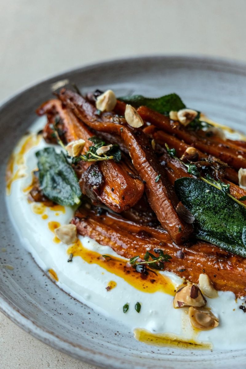 Roasted carrots with hot honey, sage, hazelnuts and Labneh