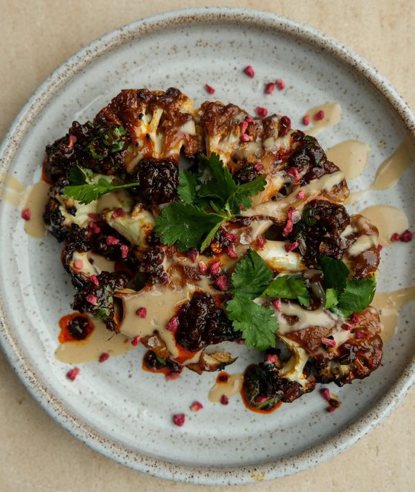 Maple glazed cauliflower steak with sweet tahini and harissa chimichurri